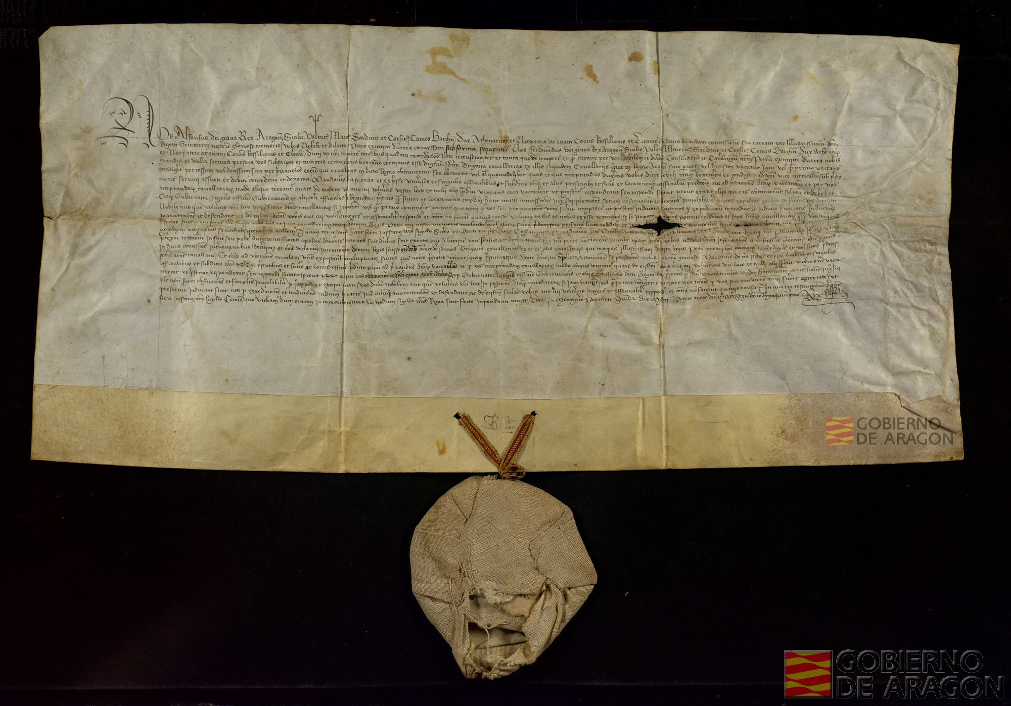 Alfonso V de Aragón confirma y matiza la concesión de treinta caballerías que Fernando I de Aragón había hecho a Pedro Jiménez de Urrea