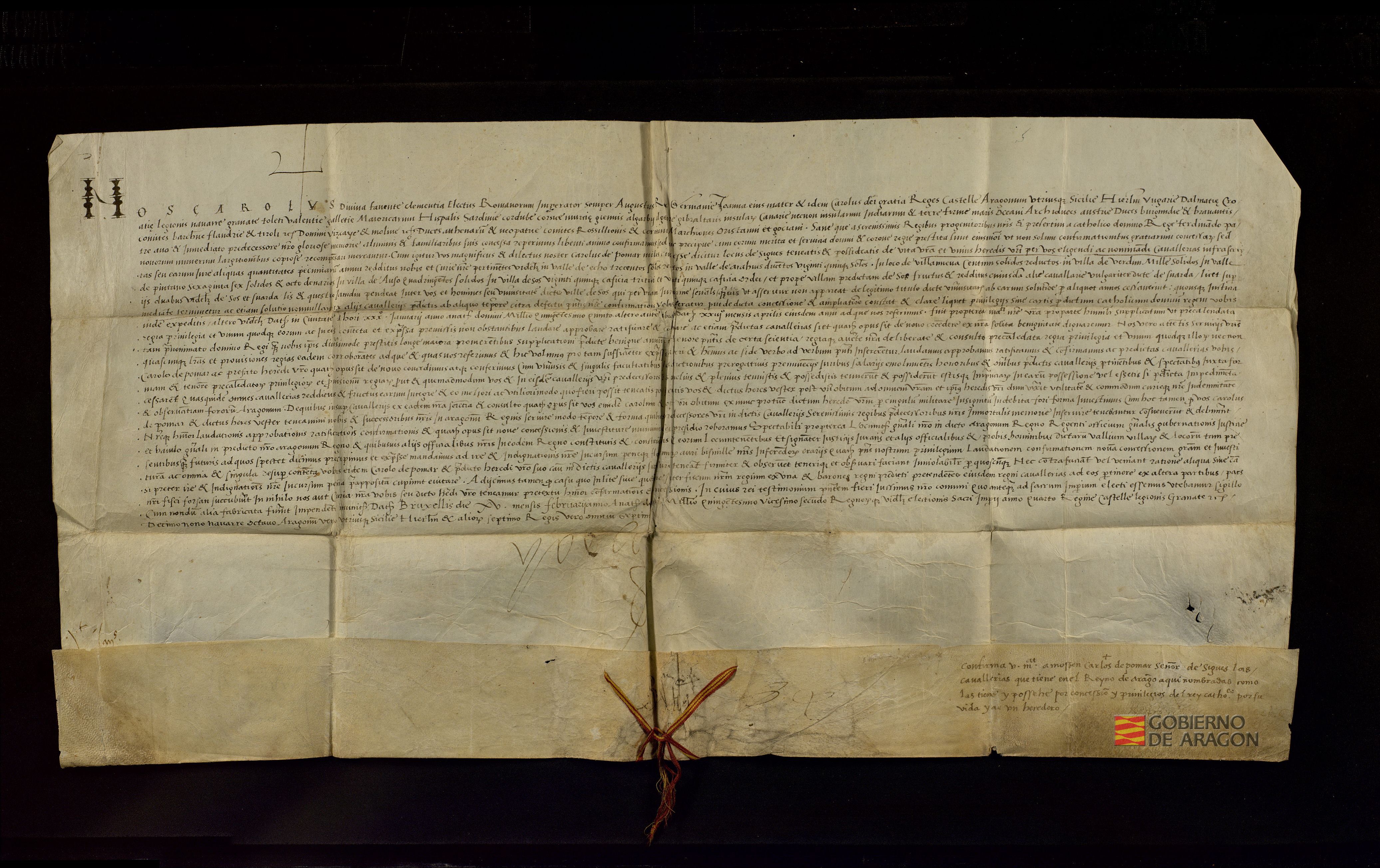 Carlos I confirma un privilegio de Fernando II de Aragón por el que se concede a Carlos de Pomar, caballero y señor de Sigüés, la posesión de las caballerías y rentas sobre los pueblos y valles de Echo, Aragüés del Puerto, Berdún, Villanúa, Pintano, Ansó y Sos.