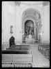 Interior de iglesia con frescos dedicados a San Luis y escultura de Inmaculada Concepción