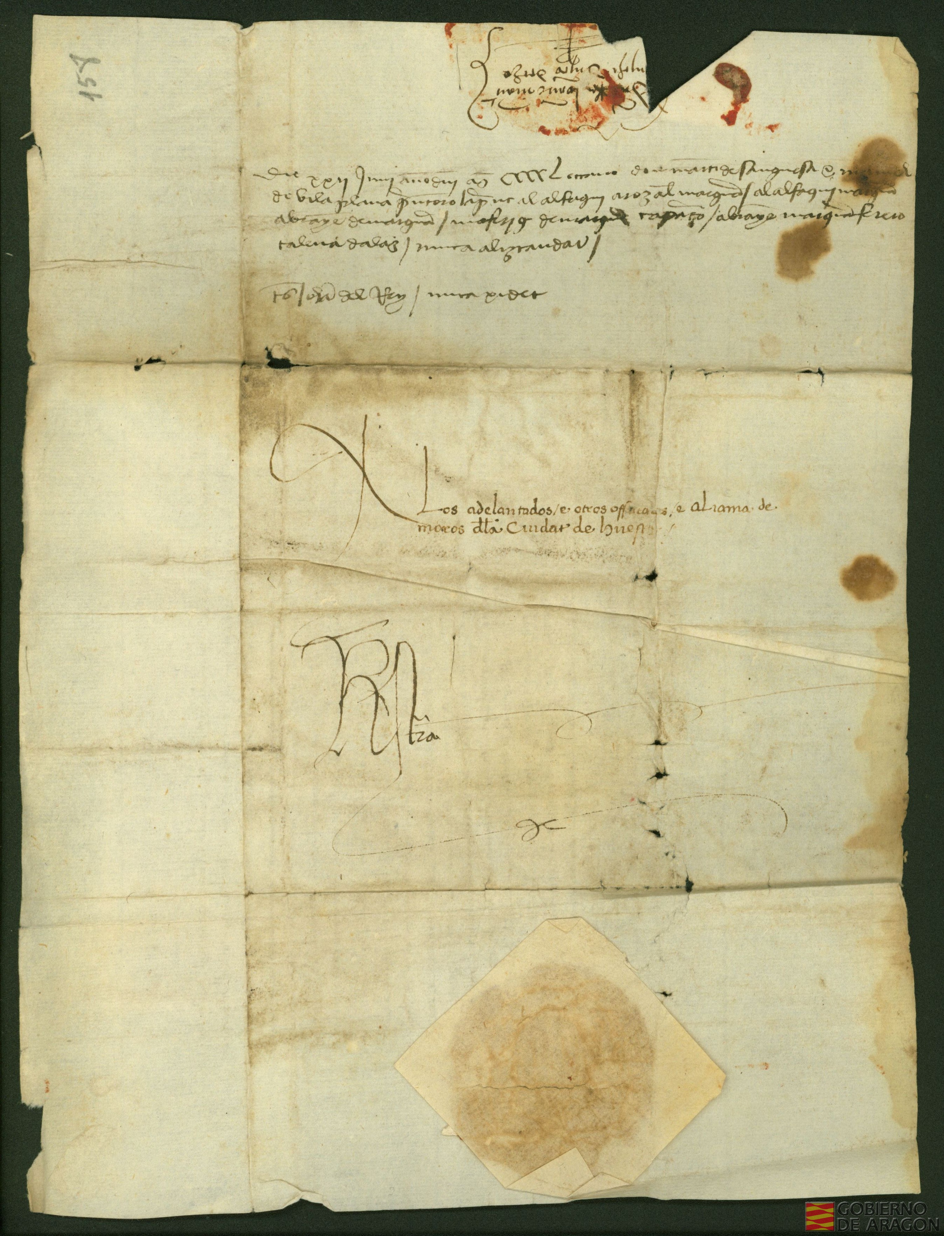 Juan II, rey de Aragón, escribe a la aljama de moros de Huesca para que paguen a Manuel de Vilaplana, mercader de Lérida, los 100 florines de oro que había tenido que pagar por unos unos moros de dicha aljama que él había asegurado y se escaparon de la prisión.