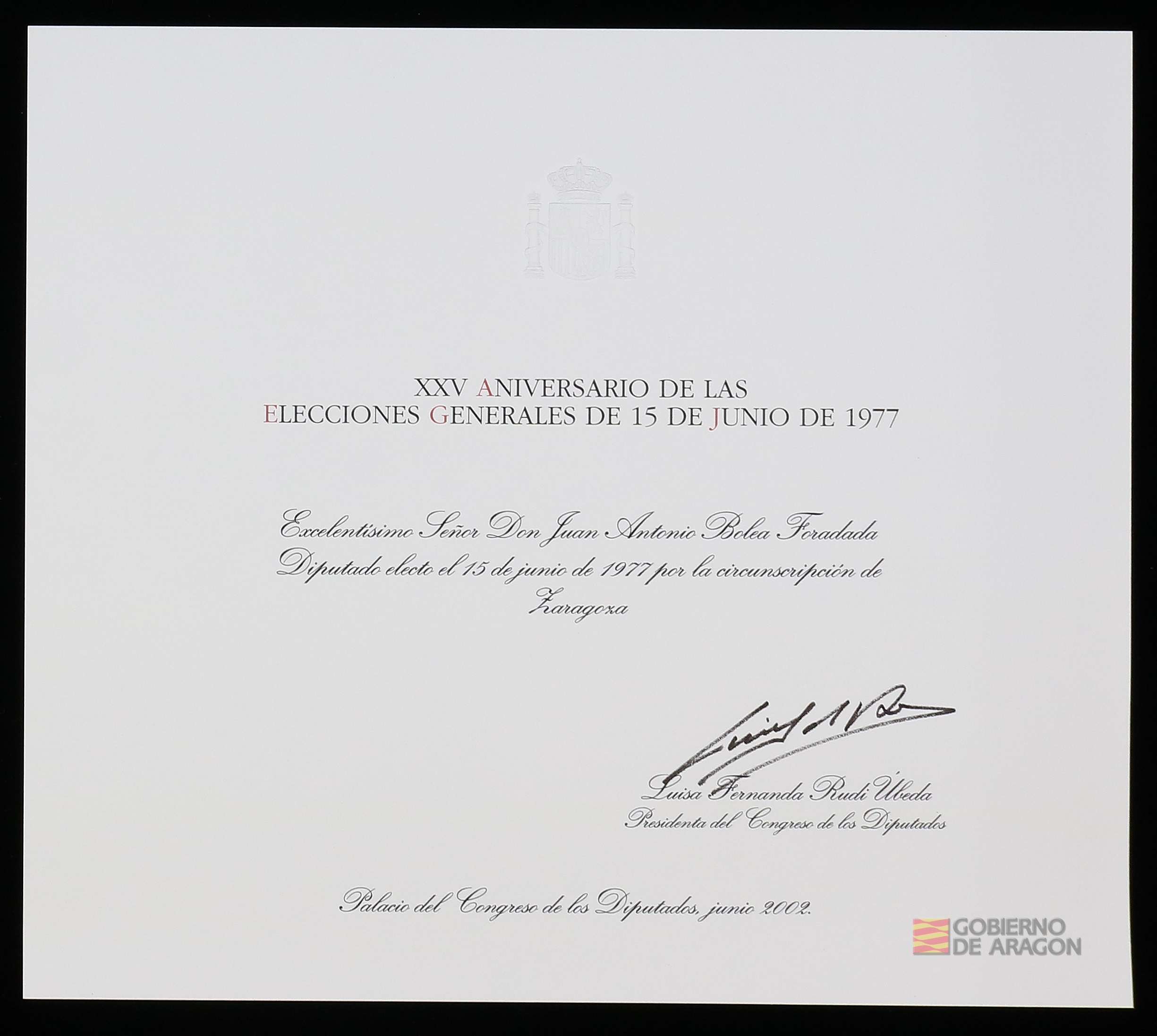 "Diploma de Diputado electo por la circunscripción de Zaragoza" de D. Juan Antonio Bolea Foradada concedido en el XXV Aniversario de las Elecciones Generales del 15 de junio de 1977. Luisa Fernanda Rudi Úbeda