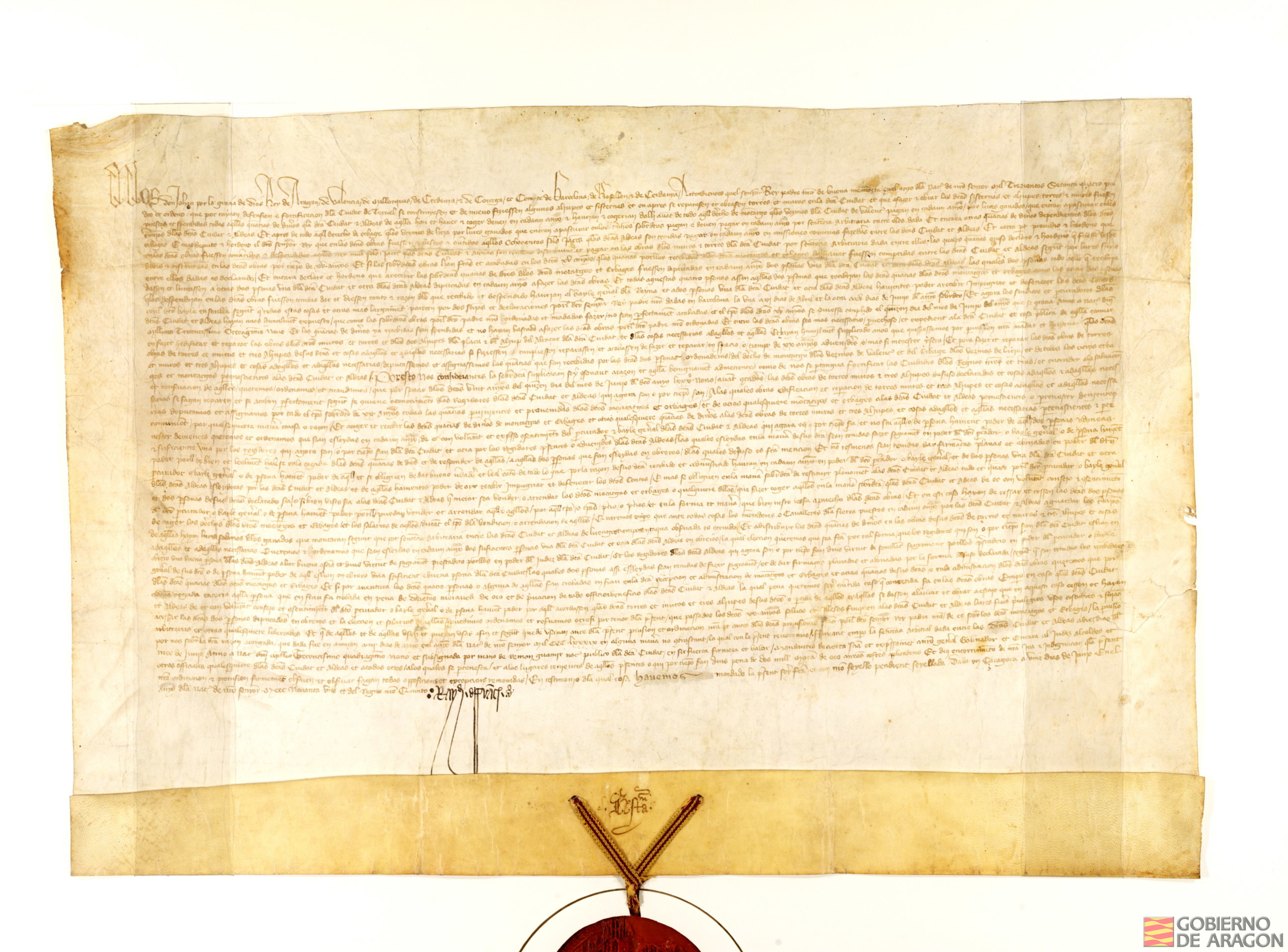 Privilegio de Juan I por el que concede prórroga para las obras de aljibes y muros en Teruel por tiempo de 20 años